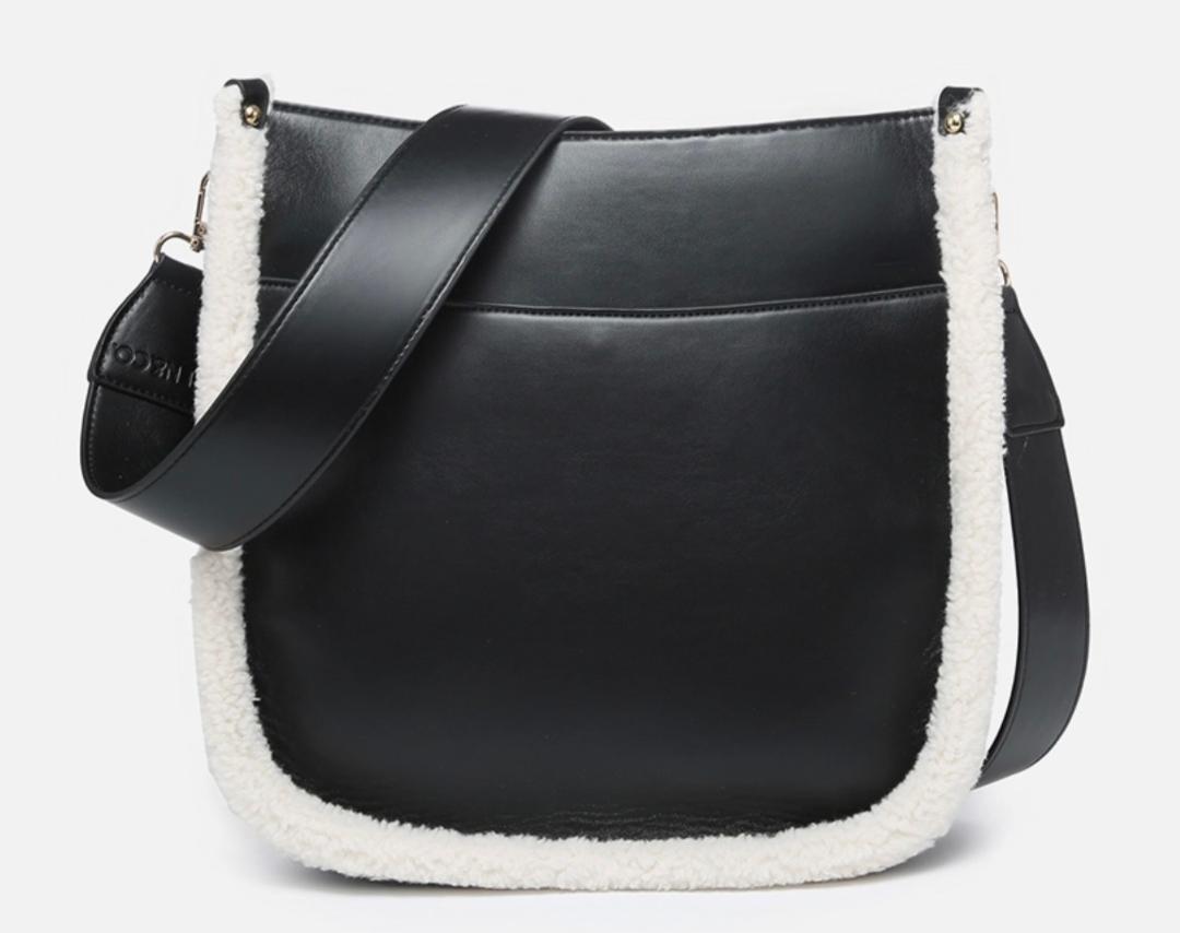 Black purse with sherpa trim